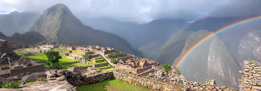 A view of Machu Picchu with a Rainbow