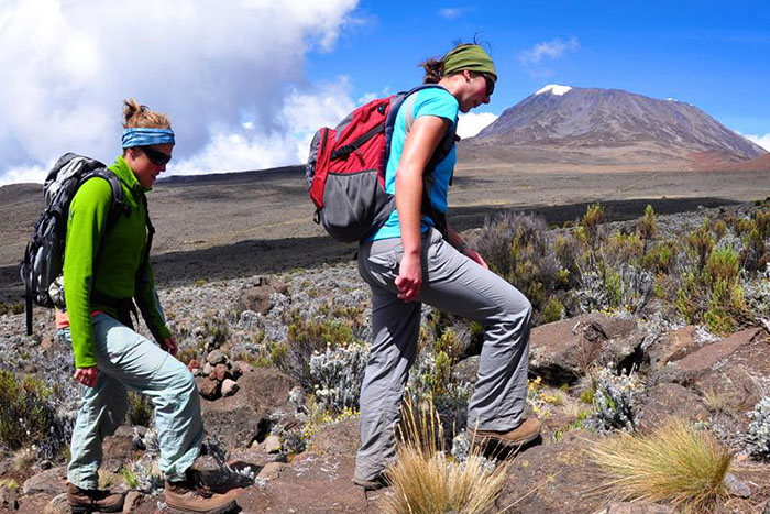 Two women hiking Mount Kilimanjaro