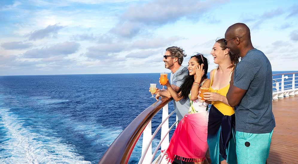 Four friends watching the ocean