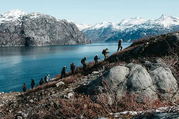 A group of explorers hike up the Alaskan Countryside (c)Uncruise