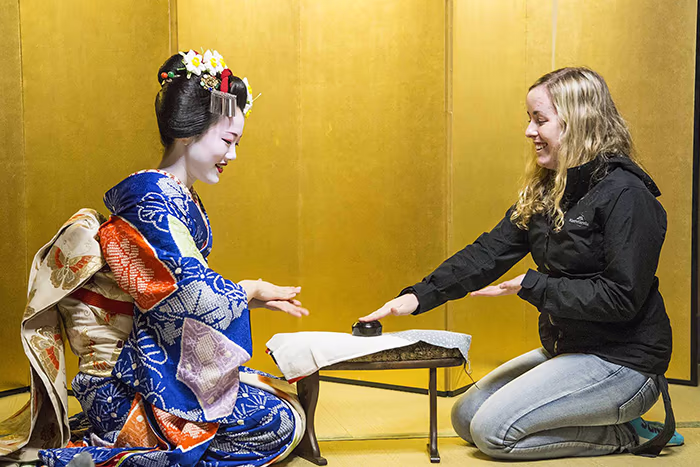 Woman meeting a Geisha