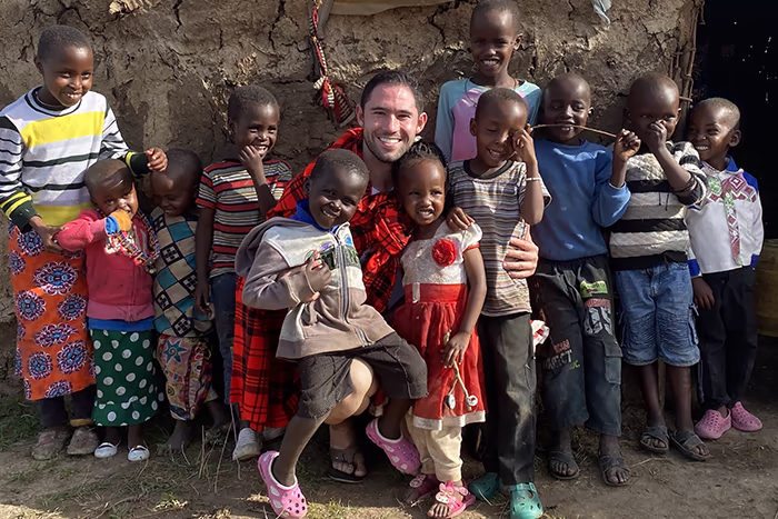 Man with Kenyan kids