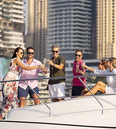 Top employees raise champagne to their success on a habur cruise