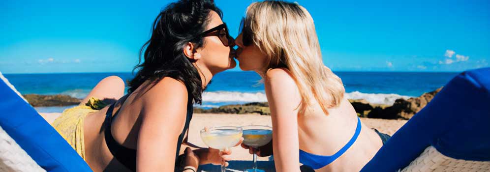 Two women kissing on a Puerto Rico beach