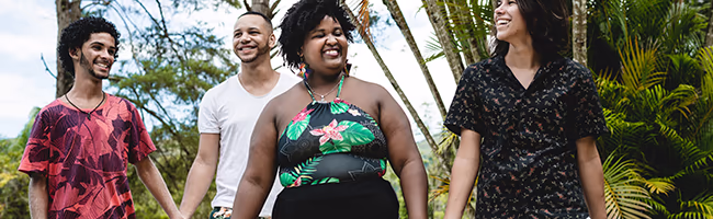 Two couples walking through a park