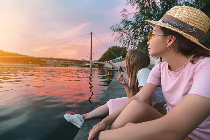 Two women looking out across the river in Lyon, France