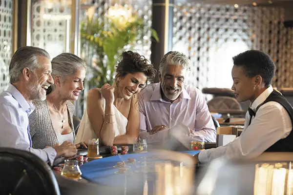 Sophisticated adults play at the casino onboard a Regent Seven Seas cruise