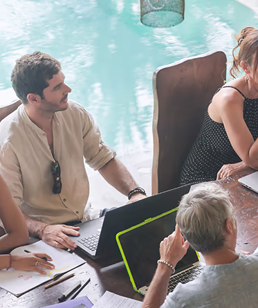 A pool-side business meeting