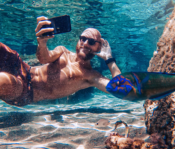 Guy taking a selfie under water