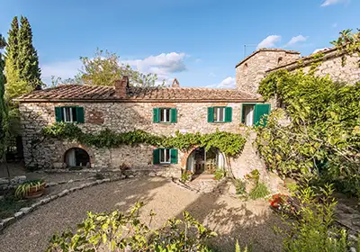 Exterior of a charming farmhouse villa in Tuscany, Italy